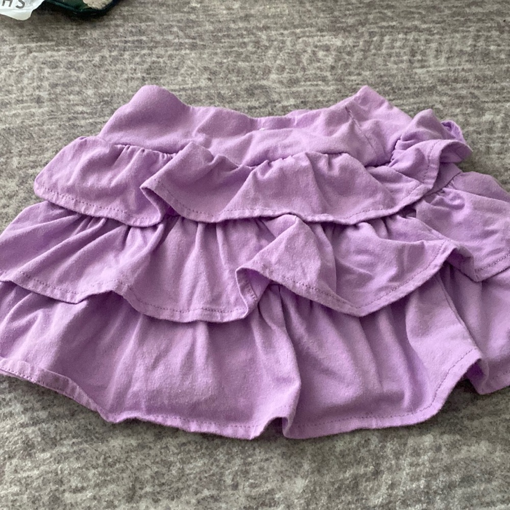 Purple ruffled skort with shorts underneath